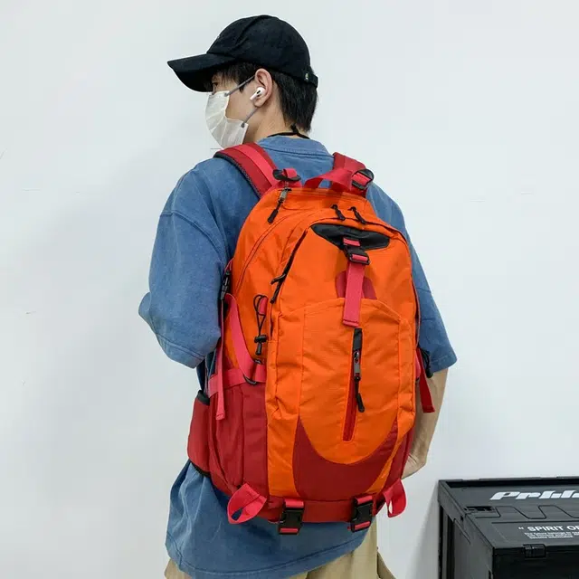 笛贝嘉 时尚简约轻便外出旅行 牛津布 双肩包 男女同款情侣款 桔红拼色