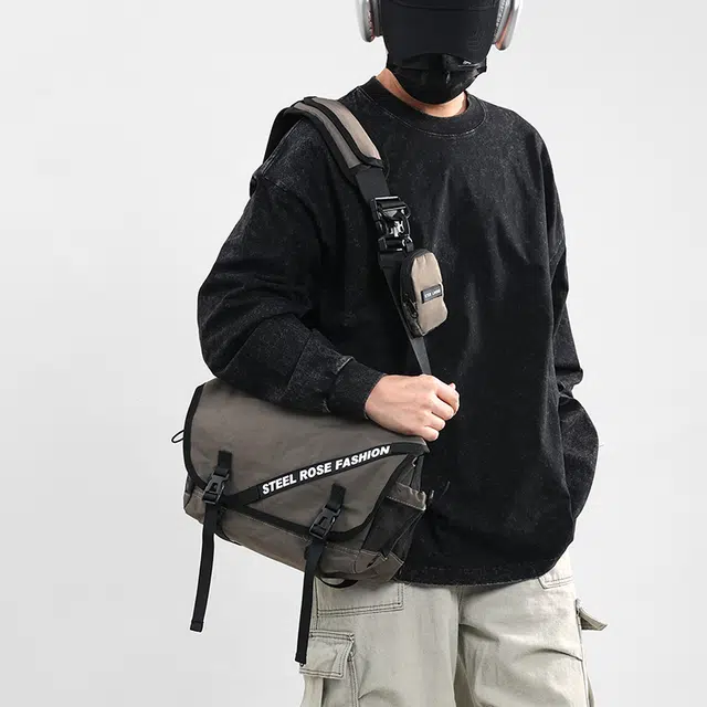 笛贝嘉 日系轻便防水休闲运动邮差单肩包简约百搭 织物 斜挎包 男女同款情侣款 多色