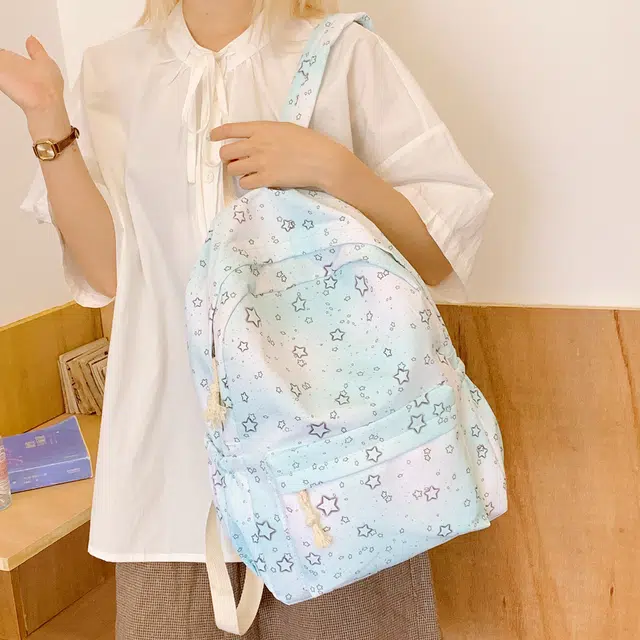 泰迪珍藏 炫彩星星背包中小学轻便可爱外出 尼龙布 双肩包 女款 浅蓝色