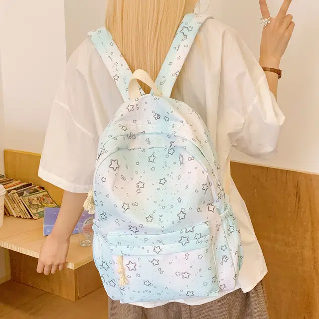 泰迪珍藏 炫彩星星背包中小学轻便可爱外出 尼龙布 双肩包 女款 浅蓝色
