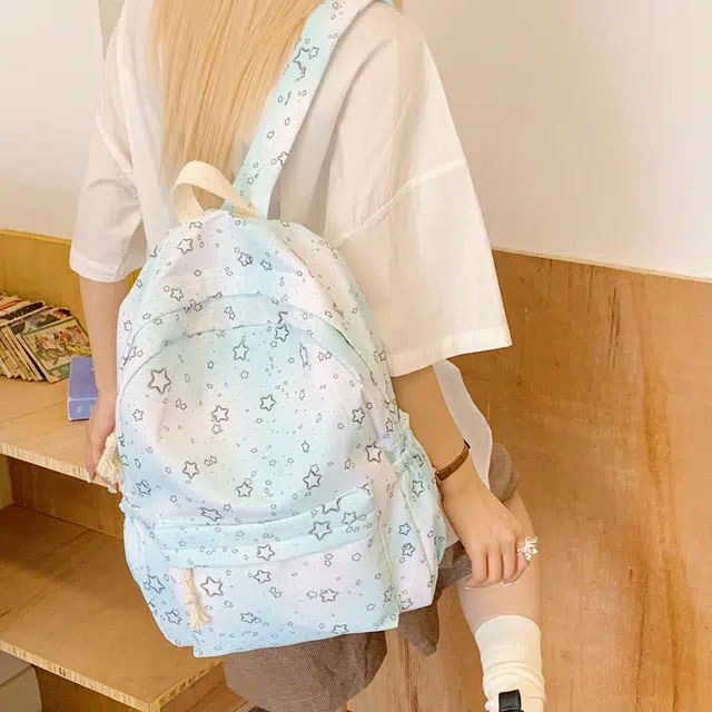 泰迪珍藏 炫彩星星背包中小学轻便可爱外出 尼龙布 双肩包 女款 浅蓝色