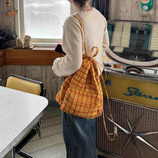 爱尔绅特 珍珠亚克力串珠可爱抽绳 帆布 双肩包帆布包 常规 女款 橘色