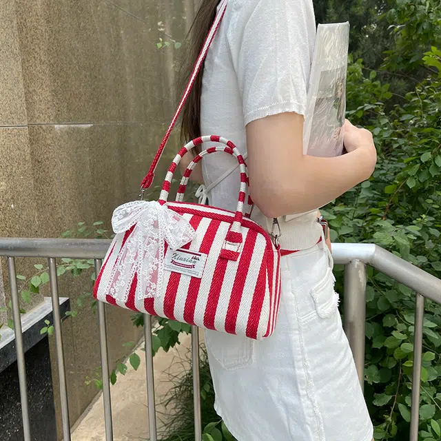 爱尔绅特 休闲拉链开合 帆布 帆布包单肩斜挎包 常规 女款 黑色/红色