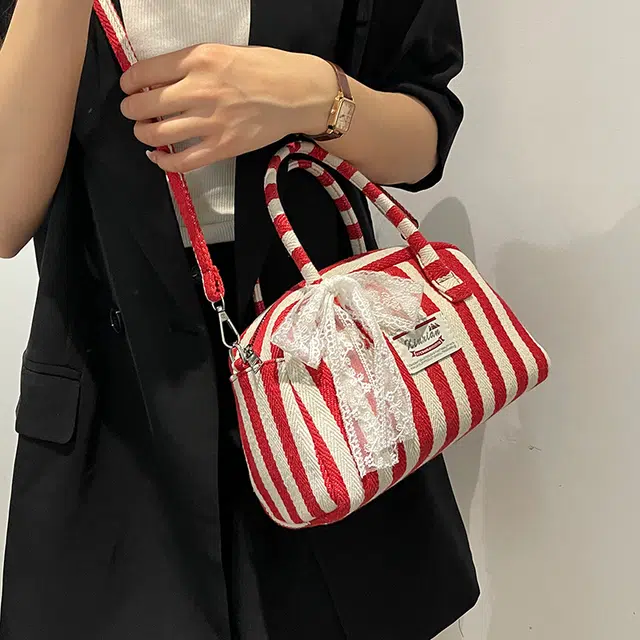 爱尔绅特 休闲拉链开合 帆布 帆布包单肩斜挎包 常规 女款 黑色/红色