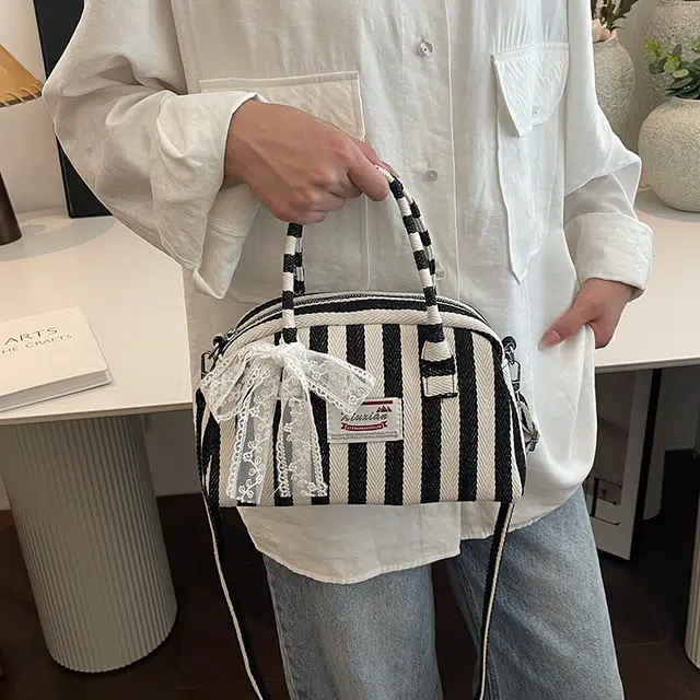 爱尔绅特 休闲拉链开合 帆布 帆布包单肩斜挎包 常规 女款 黑色/红色