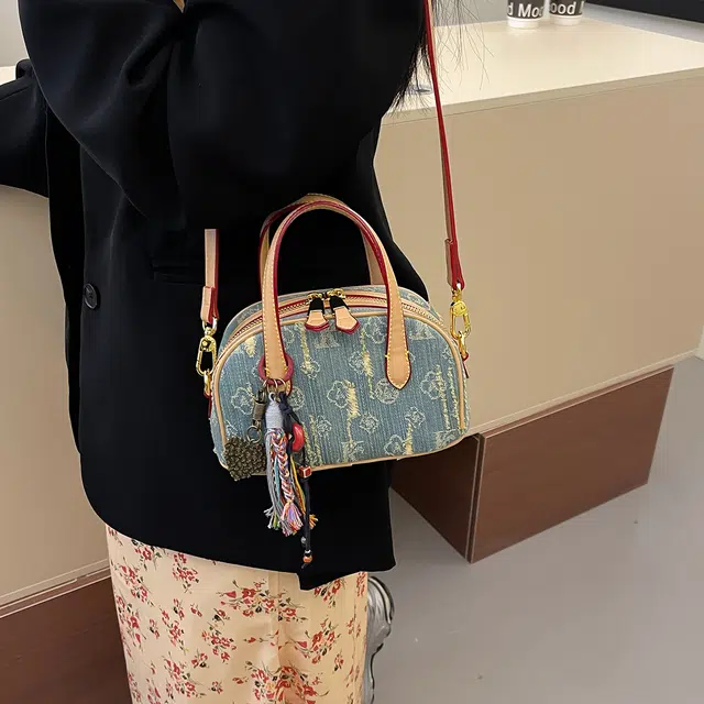 辛巴赫 复古潮流时尚气质百搭设计感 牛仔布 单肩斜挎手提包 女款 蓝色