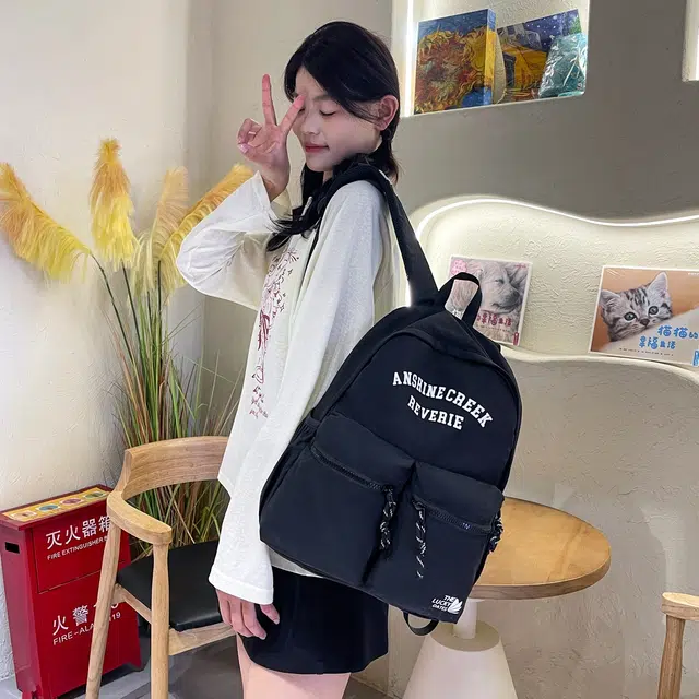 如意士 休闲日常 百搭时尚字母简约 尼龙 双肩包 常规 男女同款情侣款 多色
