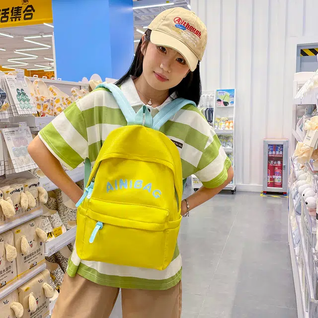 如意士 时尚潮流撞色字母书包日系大容量学院风 尼龙 双肩包 常规 男女同款情侣款 黄色/绿色