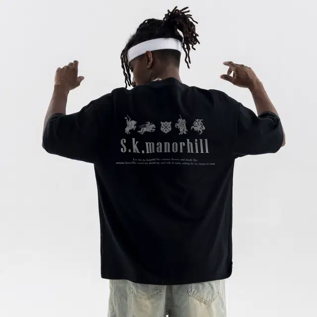 s.k. manor hill logoT