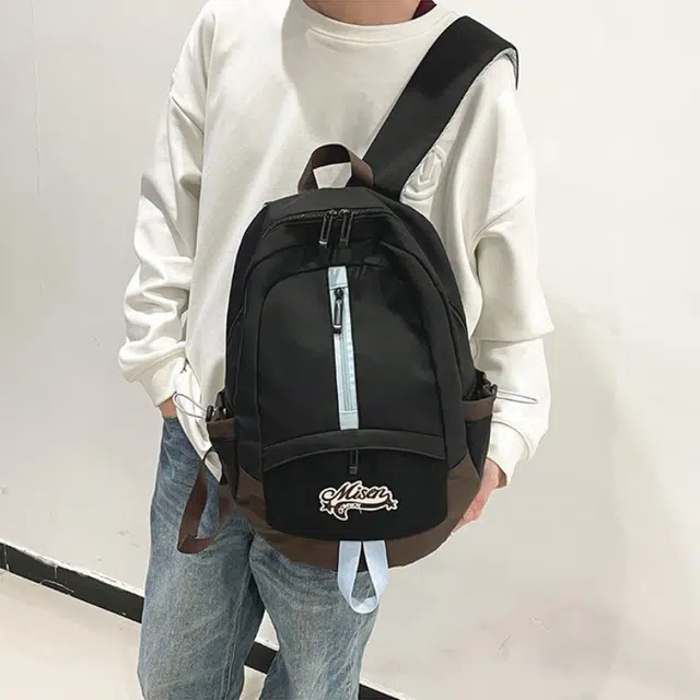 爱尔绅特 轻便休闲大容量潮流时尚小众设计 尼龙 双肩包 男女同款情侣款 白色黑色