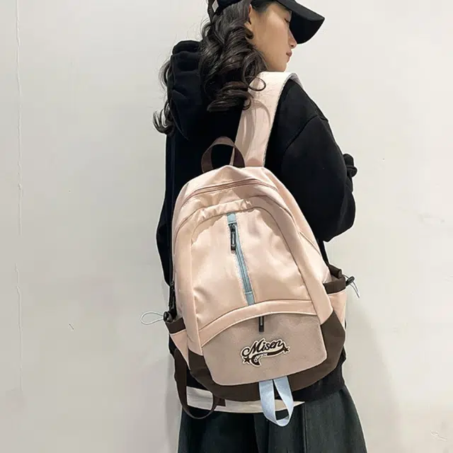 爱尔绅特 轻便休闲大容量潮流时尚小众设计 尼龙 双肩包 男女同款情侣款 白色黑色