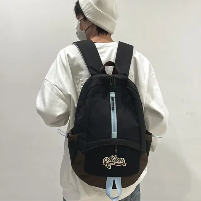 爱尔绅特 轻便休闲大容量潮流时尚小众设计 尼龙 双肩包 男女同款情侣款 白色黑色