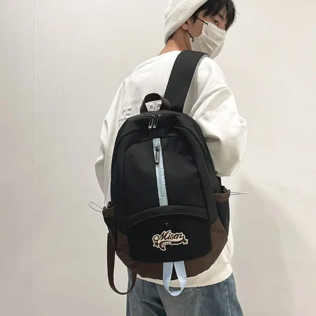爱尔绅特 轻便休闲大容量潮流时尚小众设计 尼龙 双肩包 男女同款情侣款 白色黑色
