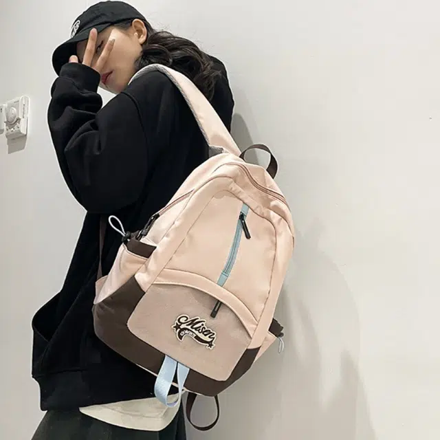 爱尔绅特 轻便休闲大容量潮流时尚小众设计 尼龙 双肩包 男女同款情侣款 白色黑色