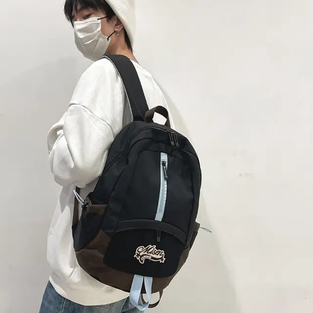 爱尔绅特 轻便休闲大容量潮流时尚小众设计 尼龙 双肩包 男女同款情侣款 白色黑色