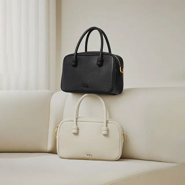 妙迪 小众设计时尚百搭精致少女上班通勤植鞣皮保龄球包学院风波士顿枕头包 牛皮 手提单肩斜挎包 常规 女款 奶昔白/曜石黑