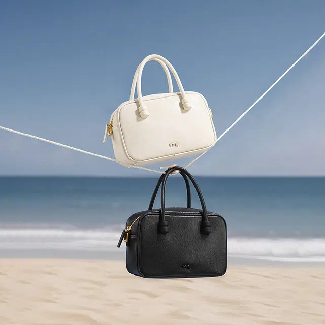 妙迪 小众设计时尚百搭精致少女上班通勤植鞣皮保龄球包学院风波士顿枕头包 牛皮 手提单肩斜挎包 常规 女款 奶昔白/曜石黑