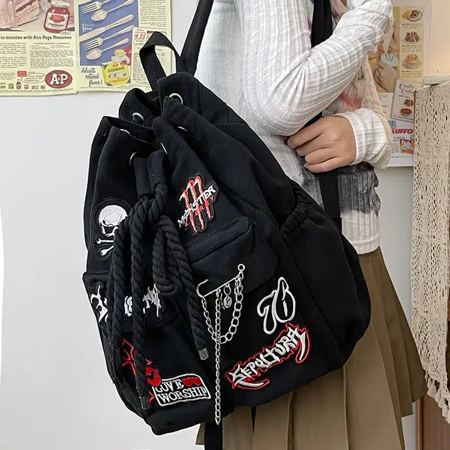 巴朗熊 潮酷大容量字母贴画上课通勤外出旅行抽绳 帆布 双肩包 常规 男女同款情侣款 黑色
