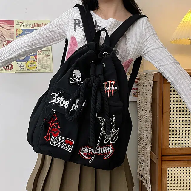 巴朗熊 潮酷大容量字母贴画上课通勤外出旅行抽绳 帆布 双肩包 常规 男女同款情侣款 黑色