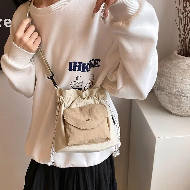 巴朗熊  韩系牛津布女时尚撞色抽绳束口水桶包潮通勤斜挎包