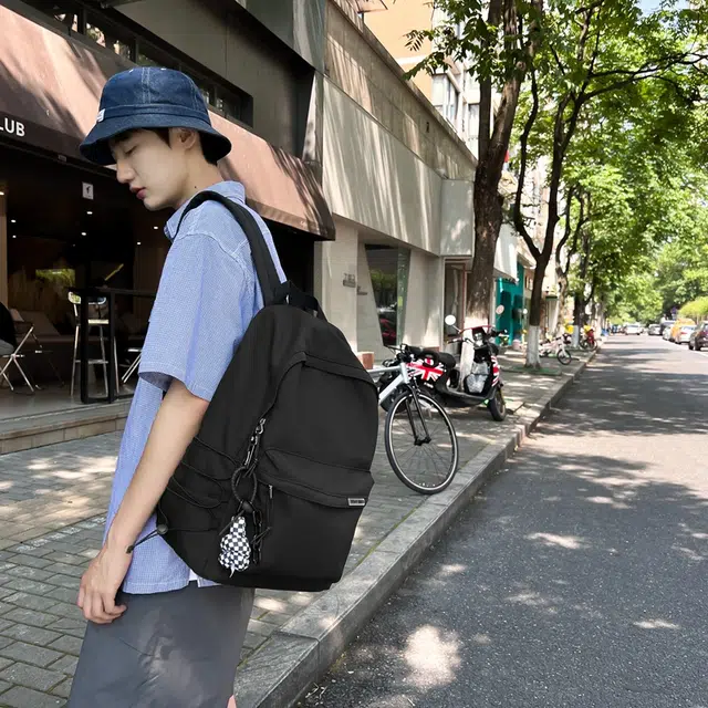 德力熊 大容量简约旅行电脑休闲高中大学生初中生 尼龙布 书包背包双肩包 常规 男女同款情侣款 黑/白