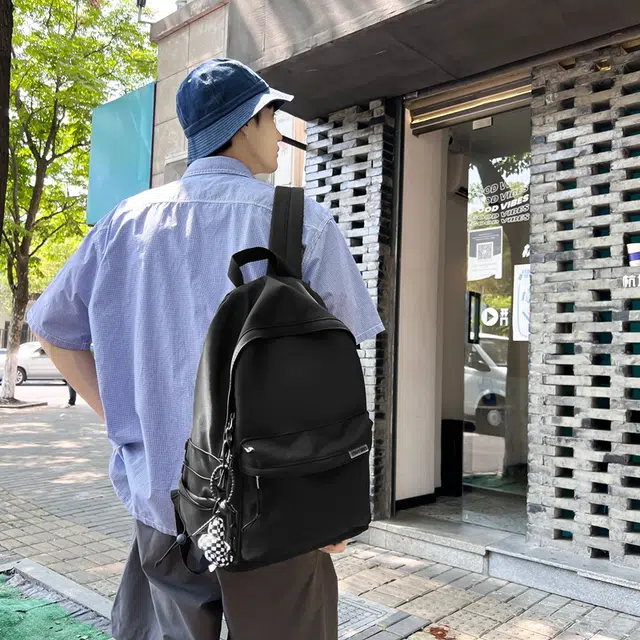 德力熊 大容量简约旅行电脑休闲高中大学生初中生 尼龙布 书包背包双肩包 常规 男女同款情侣款 黑/白