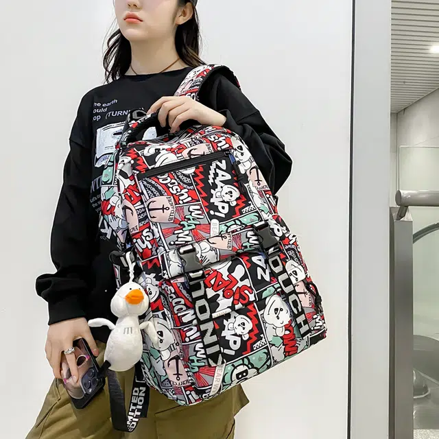 德力熊 个性涂鸦 尼龙 双肩包 男女同款情侣款 蓝/黑/紫/红