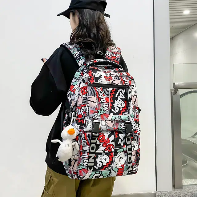 德力熊 个性涂鸦 尼龙 双肩包 男女同款情侣款 蓝/黑/紫/红