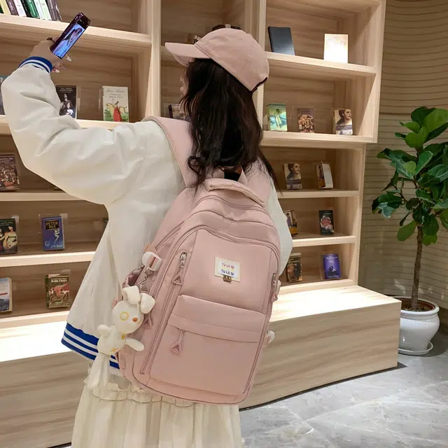 德力熊 韩版大容量简约学生减负休闲 尼龙 书包背包双肩包 常规 男女同款情侣款 粉色/黑色/白色/黄色