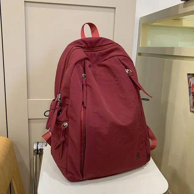 德力熊 纯色百搭大容量简约 尼龙 双肩包 常规 男女同款情侣款 黑色/白色/红色/深蓝色/粉色/卡其色