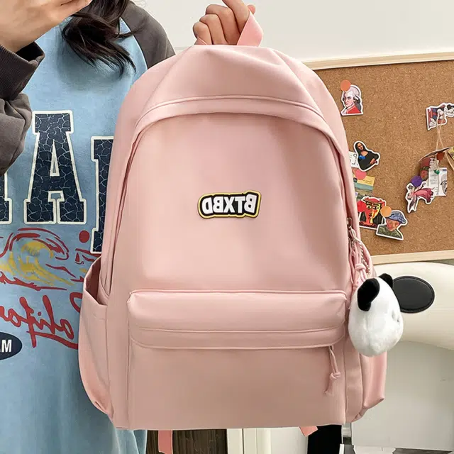 德力熊  尼龙男女通用多色高颜值学生书包纯色大容量双肩包尼龙简约百搭小众背包