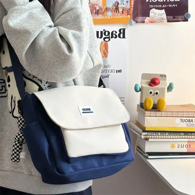 德力熊 男女通用多色学生韩版时尚上课斜挎包大容量休闲单肩包 涤纶
