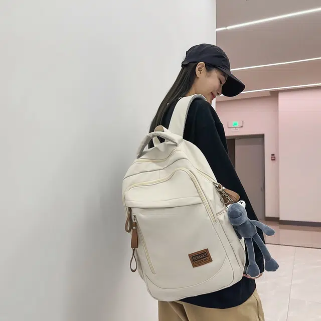 德力熊 潮牌大容量防水轻便多口袋 尼龙 书包背包双肩包 常规 男女同款情侣款 米白色/灰色/红色/蓝色/黑色