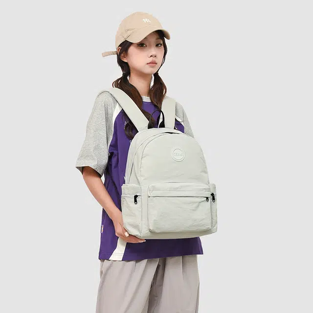 德力熊 纯色休闲简约背包轻便百搭初中高中学生大容量通勤旅行 牛津布 双肩包 女款 灰色/粉色/橘色/蓝色/黑色