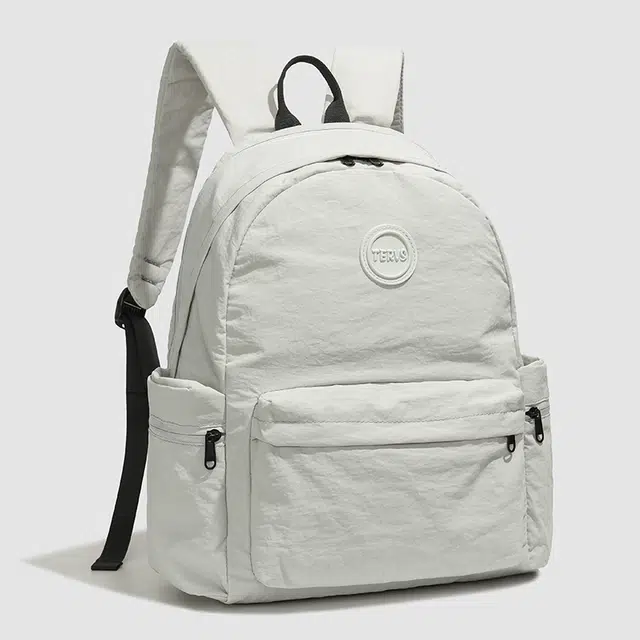 德力熊 纯色休闲简约背包轻便百搭初中高中学生大容量通勤旅行 牛津布 双肩包 女款 灰色/粉色/橘色/蓝色/黑色