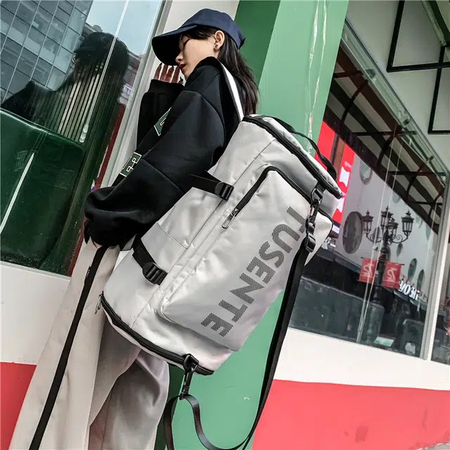 德力熊 轻便大容量多功能休闲单肩斜挎两背 牛津布 书包背包双肩包 大号 男女同款情侣款 黑/红/灰
