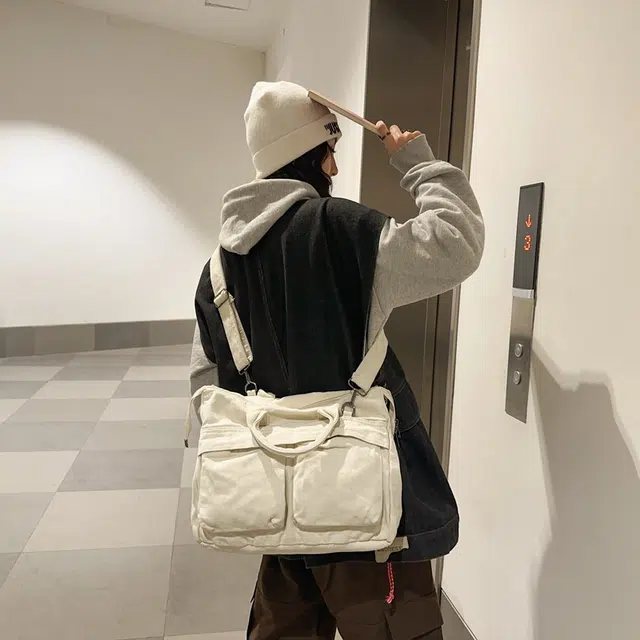 德力熊 大容量日系复古通勤拉链开合 帆布 单肩包 常规 男女同款情侣款 黑/白/绿/棕