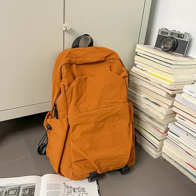 德力熊 纯色简约大容量轻便百搭 尼龙 双肩包 常规 男女同款情侣款 黑色/灰色/棕色/绿色
