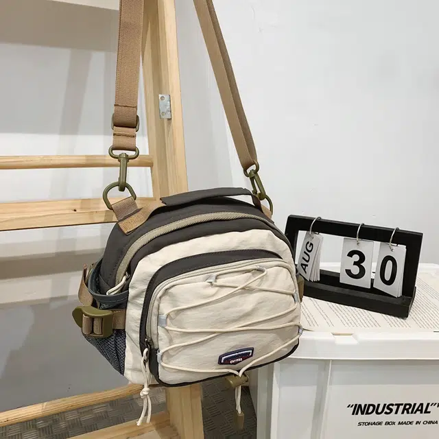 德力熊 个性撞色多功能双肩包潮牌百搭单肩包小众设计多背法手提包 尼龙 斜挎包 常规 男女同款情侣款 多色