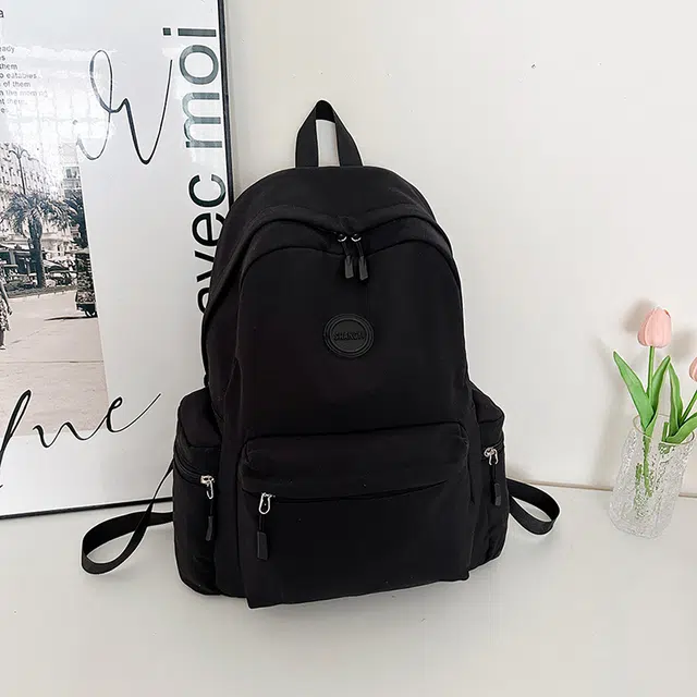 德力熊 纯色百搭大容量旅游背包书包 牛津布 双肩包 常规 男女同款情侣款 黑色/红色/卡其色/白色