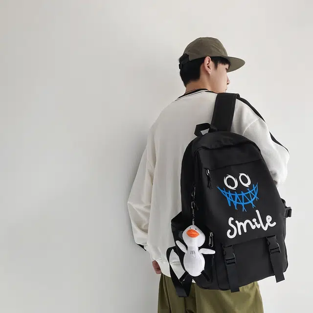 德力熊 轻便休息时尚百搭 尼龙 书包背包双肩包 常规 男女同款情侣款 黑色大牙/白色大牙/白色笑脸/白色笑脸