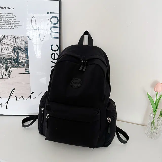 德力熊 纯色百搭大容量旅游背包书包 牛津布 双肩包 常规 男女同款情侣款 黑色/红色/卡其色/白色