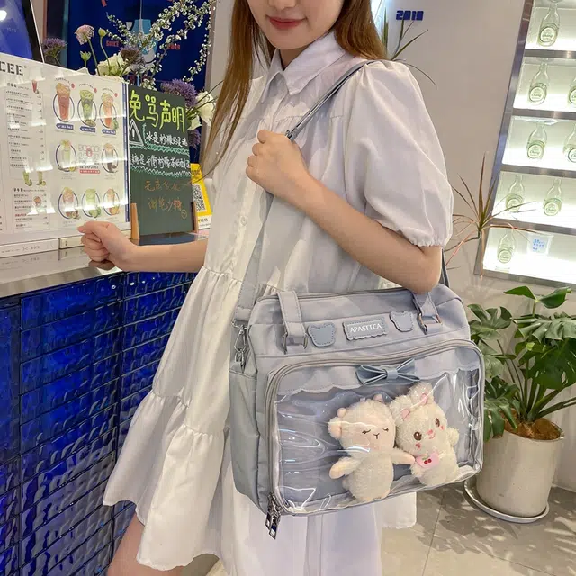 德力熊 日系软妹蝴蝶结 尼龙 斜挎单肩包 常规 女款 粉/蓝/白/黑