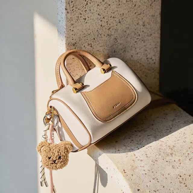 纳兰杜 上班通勤洋气高级感保龄球波士顿包 牛皮 单肩斜挎手提包 小号 女款 米白拼杏/子夜黑