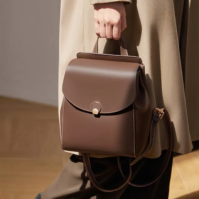 纳兰杜 大容量出行旅游高级感百搭高中生初中生轻便 牛皮拼合成革 背包双肩包 大号 女款 白拼咖色