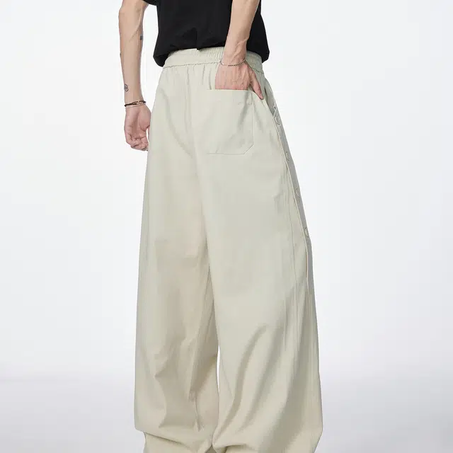 领航骆驼 美式复古纽扣拼接设计潮流百搭休闲牛仔裤 男女同款