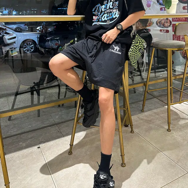 领航骆驼 舒适速干中腰宽松网眼透气百搭轻便舒适设计感休闲短裤 男女同款 黑