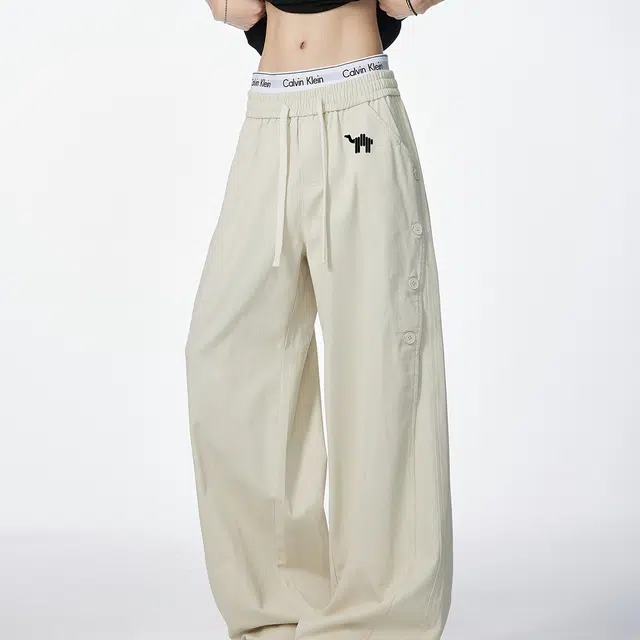 领航骆驼 美式复古纽扣拼接设计潮流百搭休闲牛仔裤 男女同款