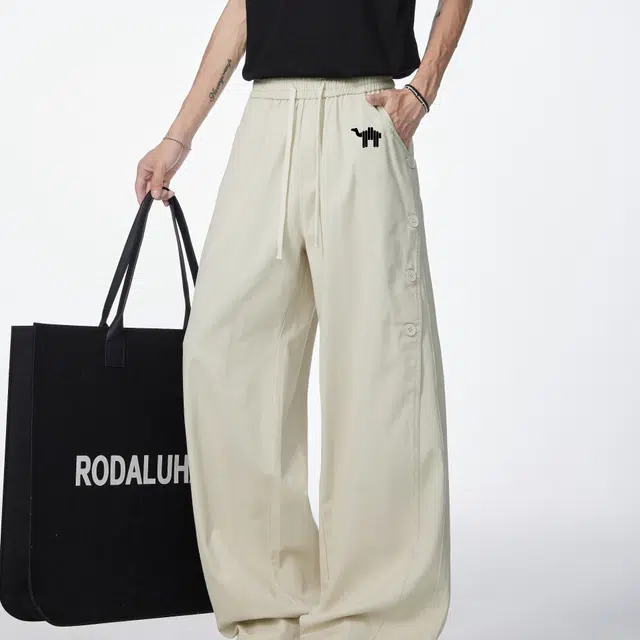 领航骆驼 美式复古纽扣拼接设计潮流百搭休闲牛仔裤 男女同款