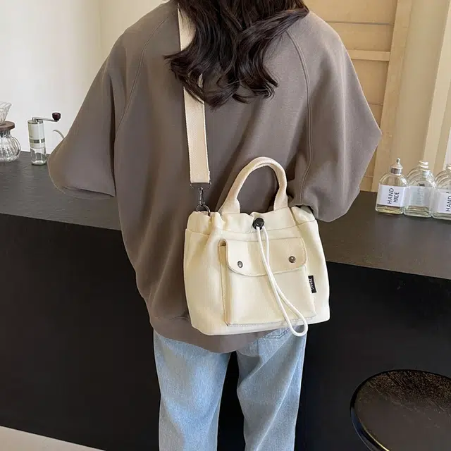 伊曼家 运动风潮流帅气简约时尚小众轻便包包 帆布 帆布包单肩包 女款